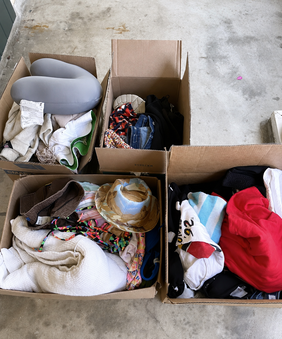 Boxes of clothing and household items selected for donation after a closet organizing session in Metairie