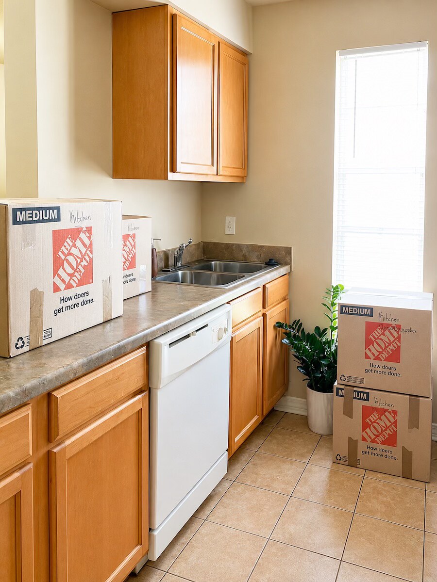Kitchen items packed into labeled boxes for a Metairie move