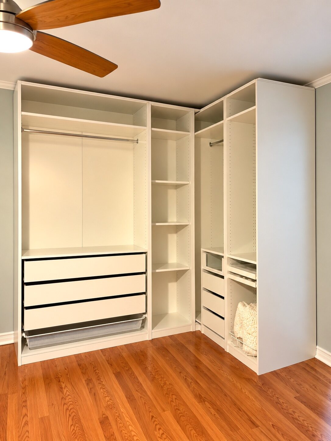 Newly built custom closet in a New Orleans bedroom before the client's clothing was unpacked