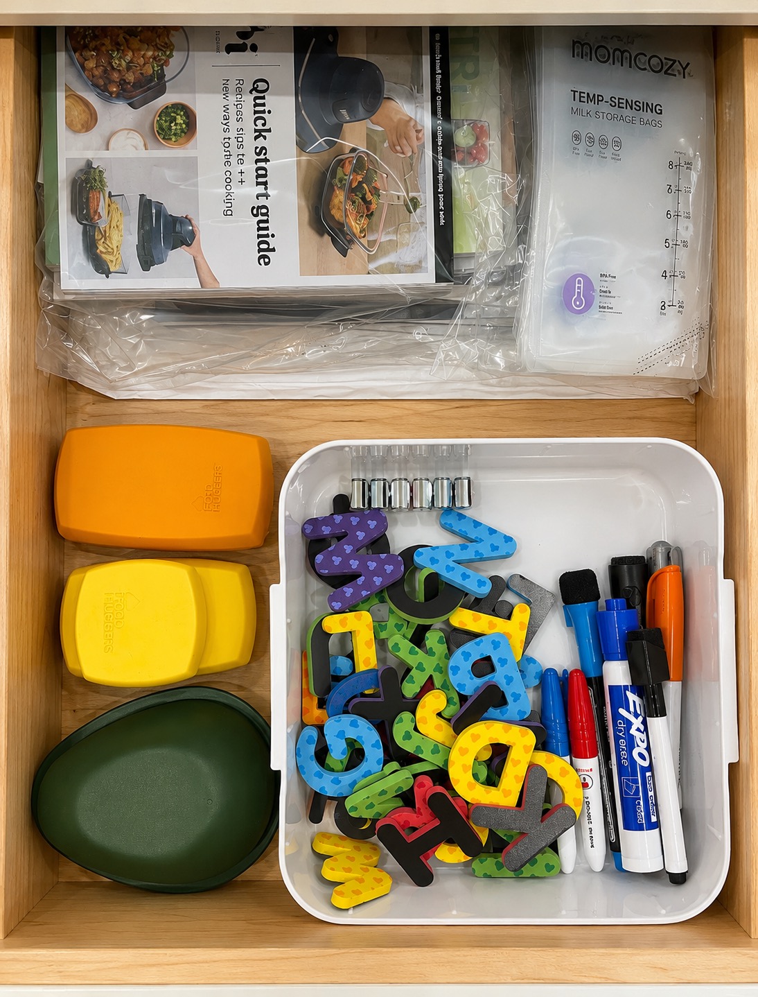 Miscellaneous kitchen drawer items sorted into practical groups