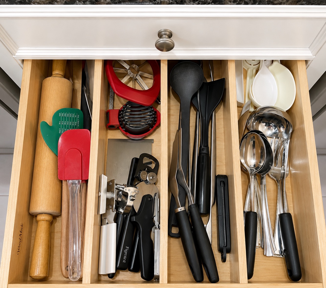 Everyday kitchen utensils sorted in an organized drawer