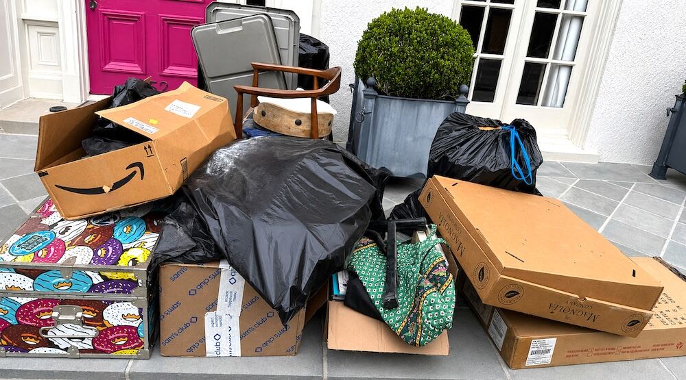 Donations and trash staged outside a New Orleans home after a Nola Organizers decluttering session