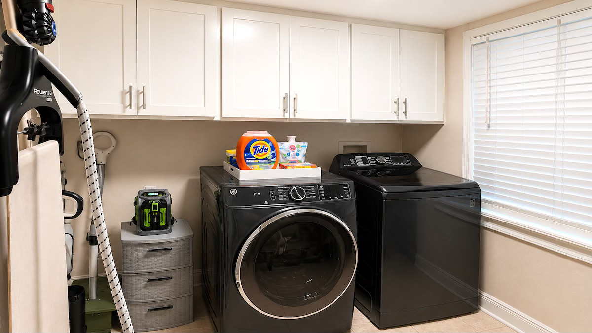 Organized laundry room with washer and dryer by Nola Organizers New Orleans