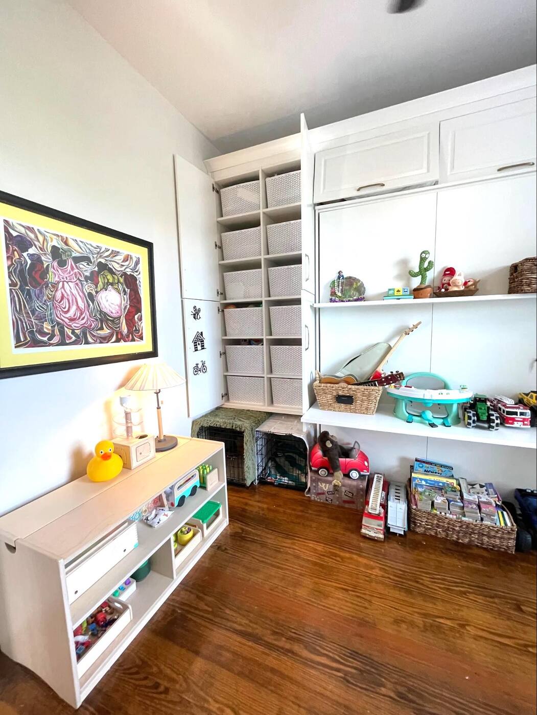 Playroom with organized toy bins and labeled categories by Nola Organizers