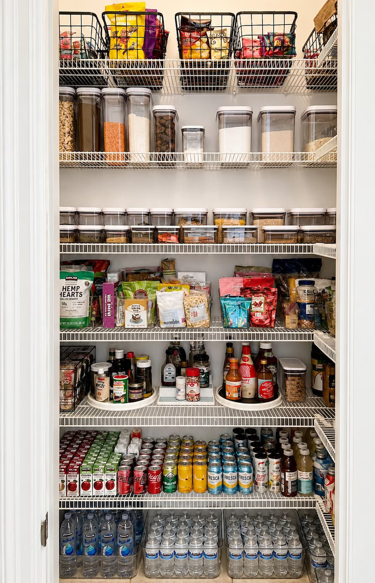 Walk-in pantry with wire shelves organized by category by Nola Organizers