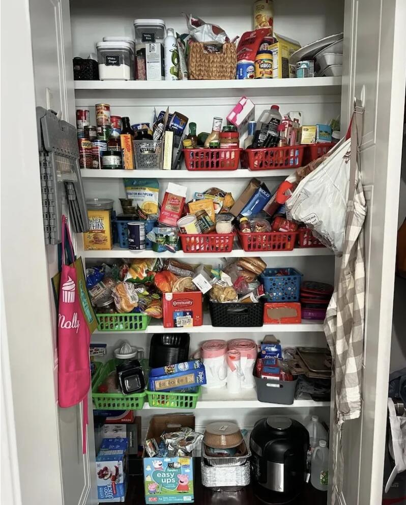 Cluttered kitchen pantry before organization by Nola Organizers New Orleans