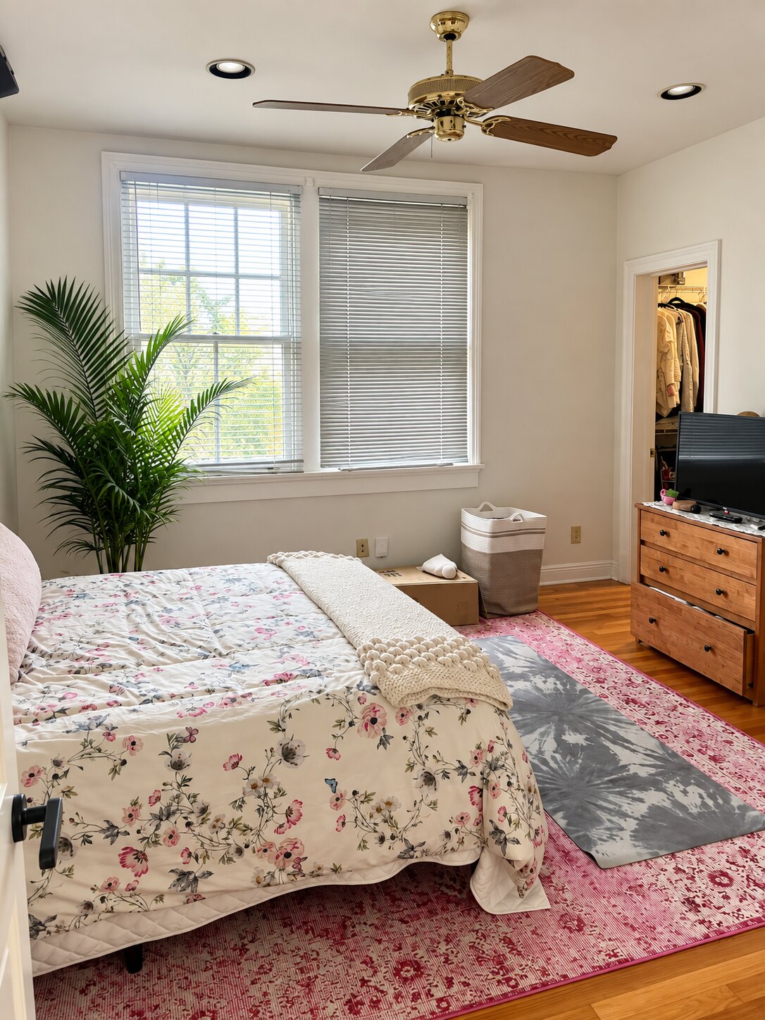 Comfortable, organized bedroom prepared by Nola Organizers