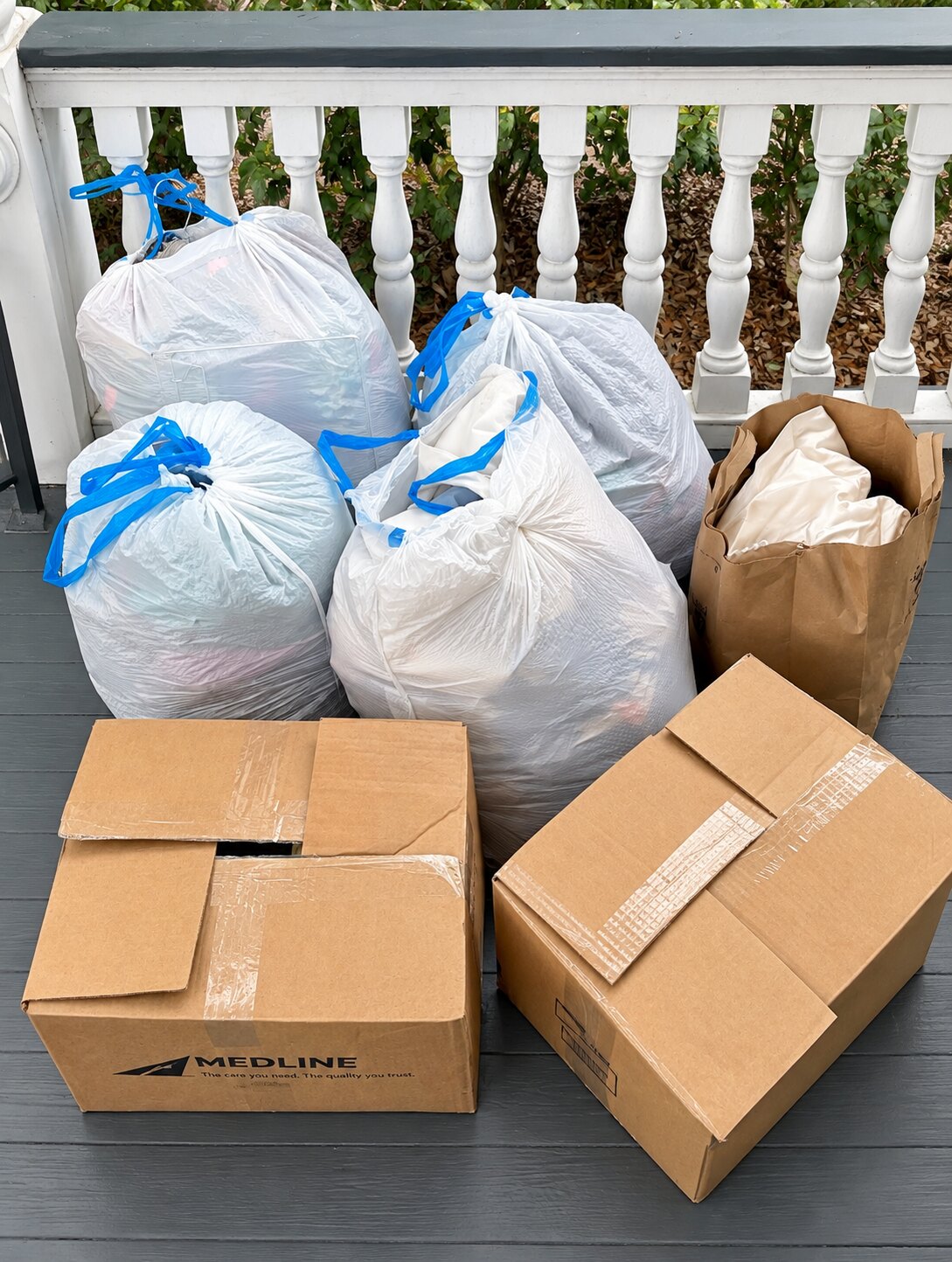 Bagged and boxed donations prepared during a senior decluttering project