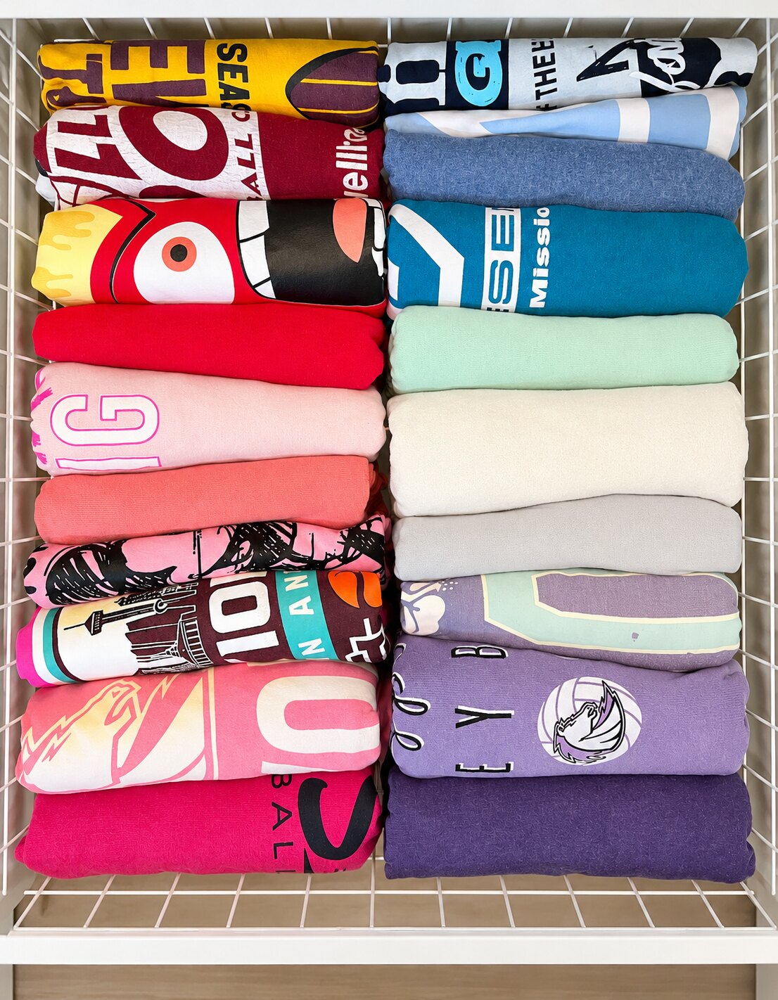 Folded shirts arranged neatly in an easy-to-see drawer