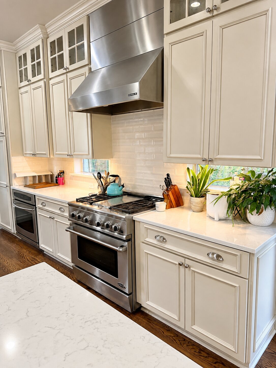 Organized kitchen with clear counters and everyday items placed within easy reach